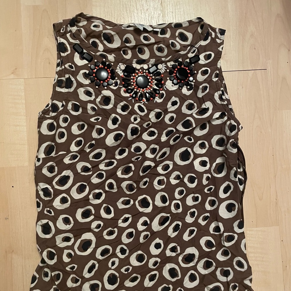 Multiple women’s blouses/shirts for work